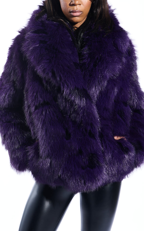 dark purple faux fur statement coat with an oversized collar and two front pockets