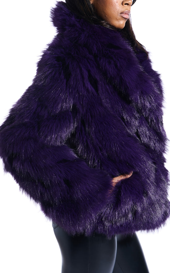 dark purple faux fur statement coat with an oversized collar and two front pockets