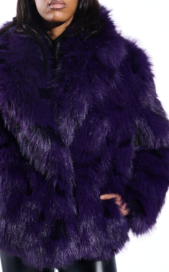 dark purple faux fur statement coat with an oversized collar and two front pockets