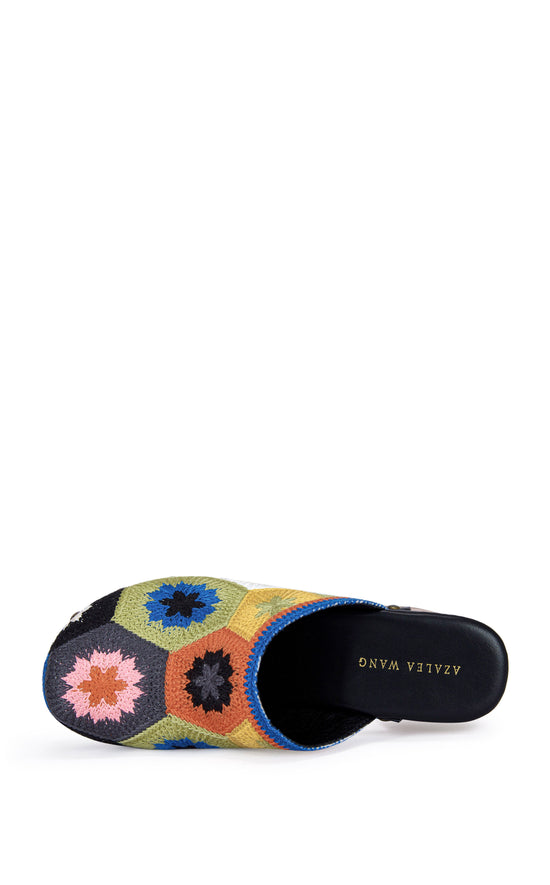 slip on platform statement clog with a block heel and a multicolored floral embroidered pattern on the upper