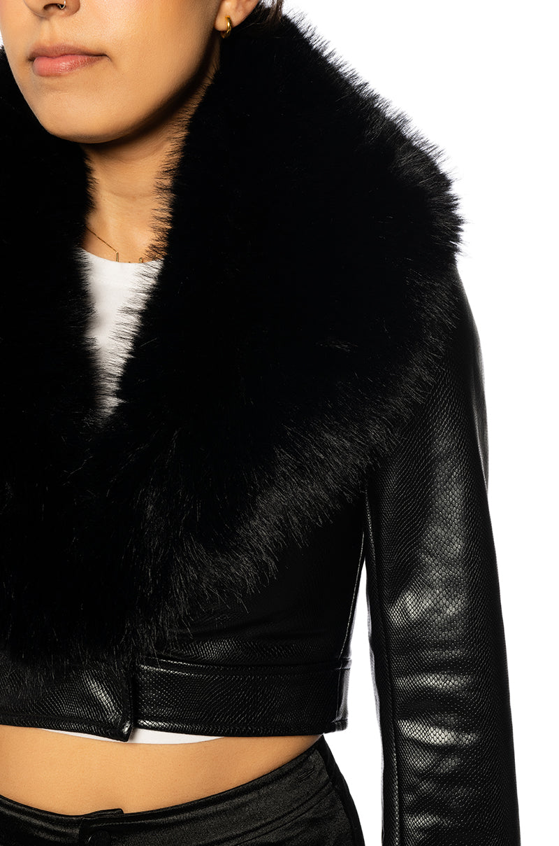 detail shot of Black faux leather cropped jacket with fur lined collar and fur lined cuffs