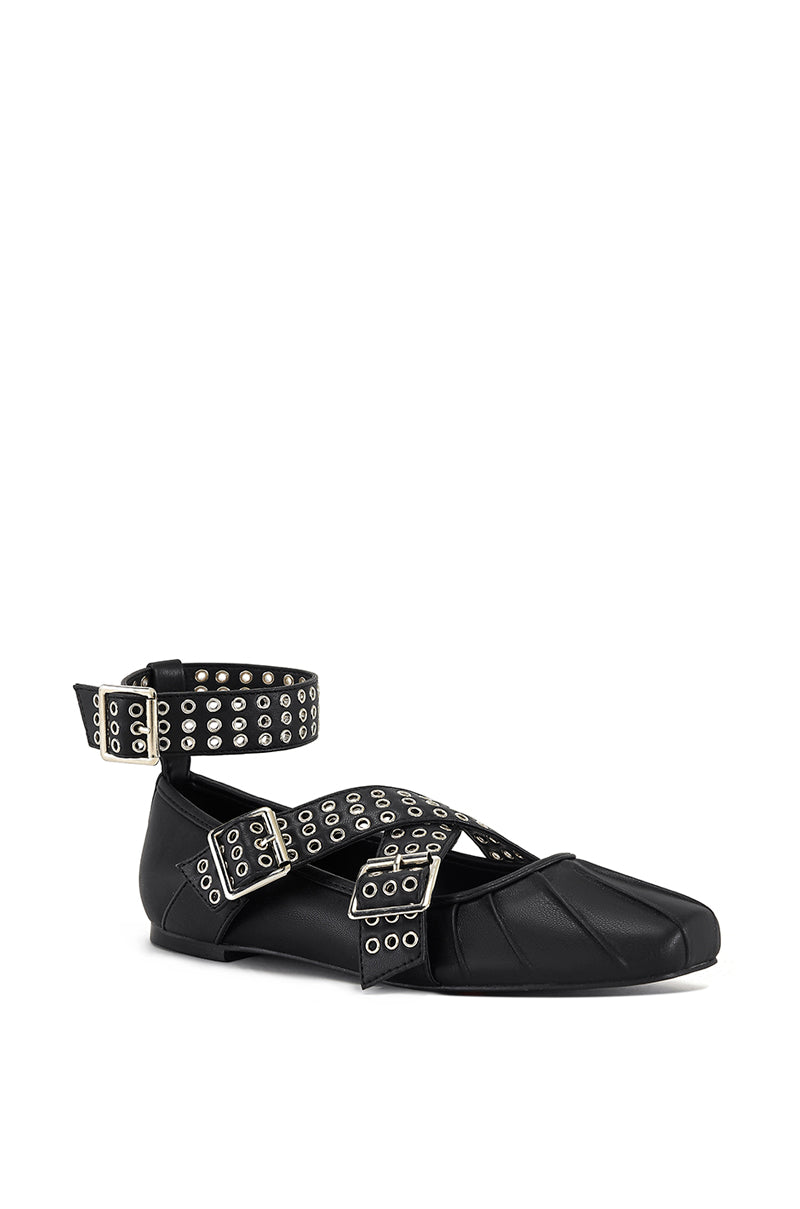 angled view of black ballet flats with edgy grommet belt strap accents and a chic ankle strap