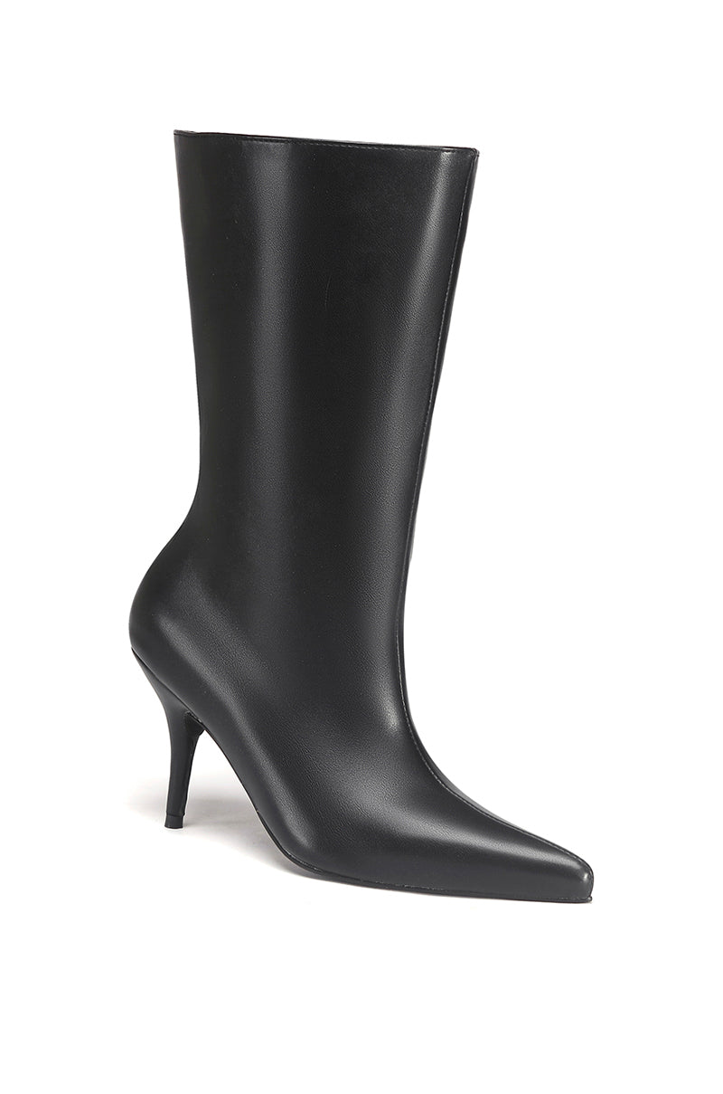 side view of sleek black faux leather pointed toe stiletto boot with a flared opening