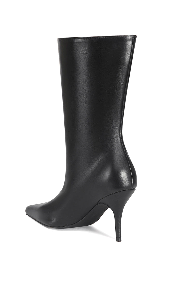 back view of sleek black faux leather pointed toe stiletto boot with a flared opening