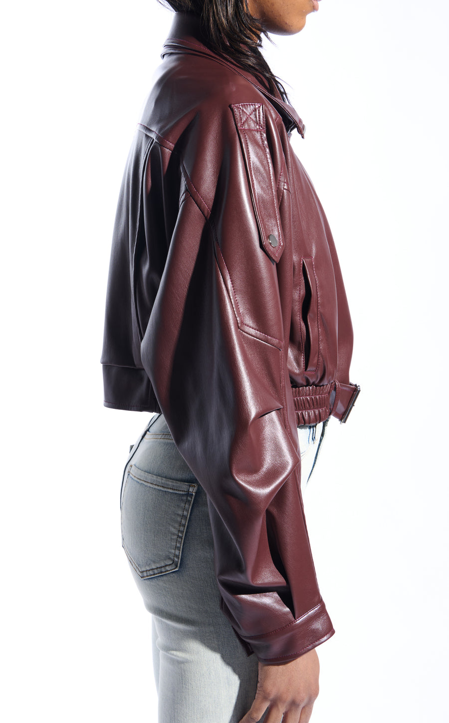 buttery soft burgundy faux leather statement jacket with a zip up front closure, puffy sleeves, and a belted accent on the bottom