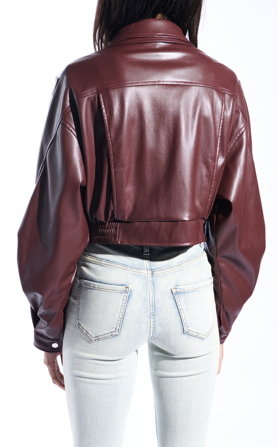 buttery soft burgundy faux leather statement jacket with a zip up front closure, puffy sleeves, and a belted accent on the bottom