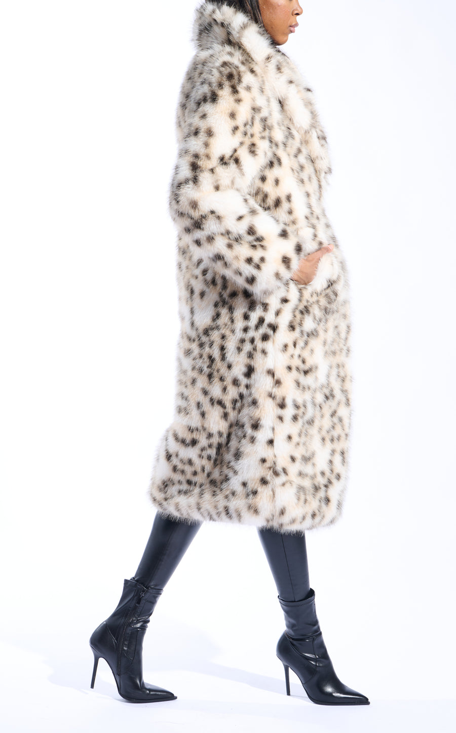 white snow leopard print faux fur trench coat with an oversized collar and pockets on the front sides