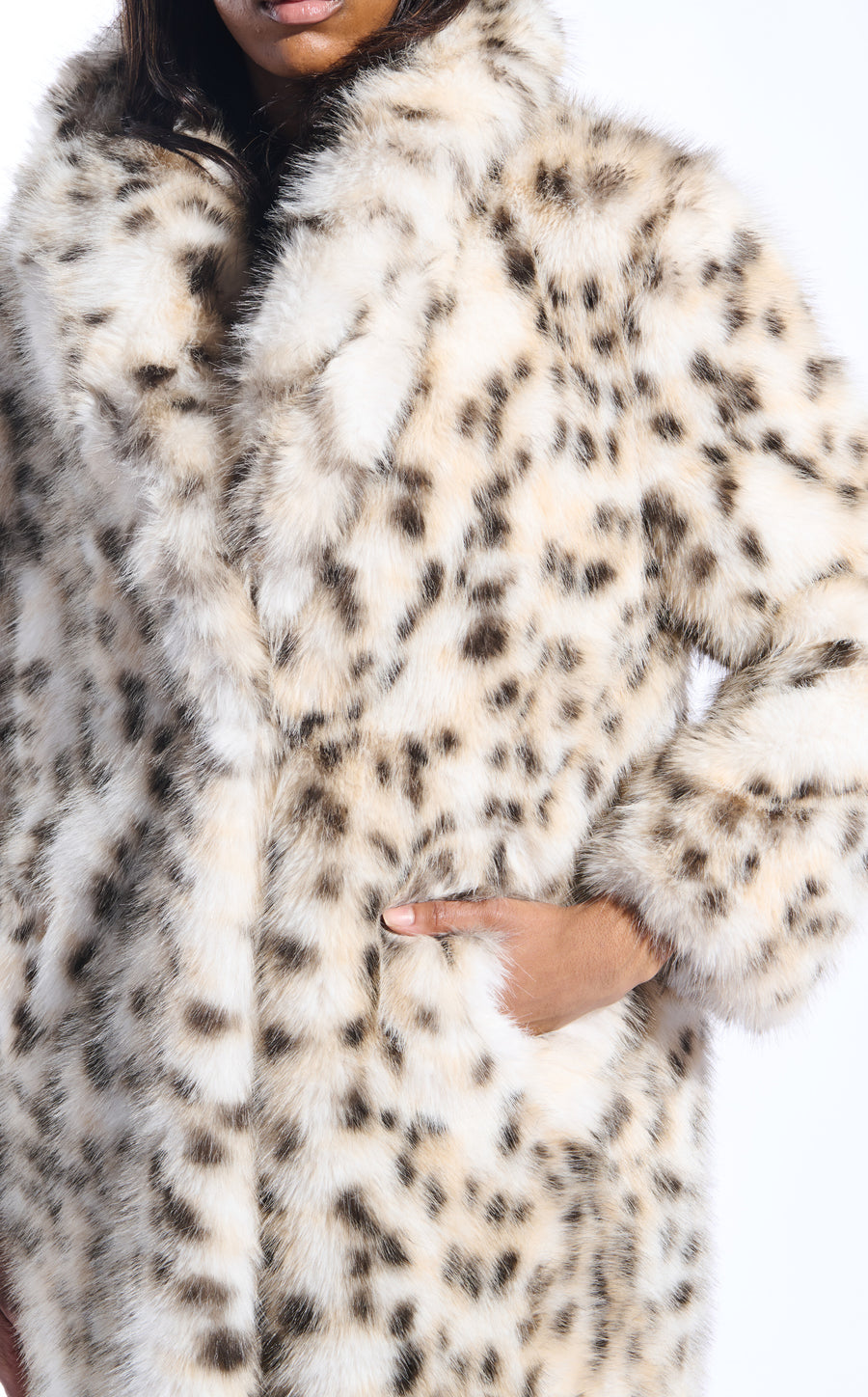 white snow leopard print faux fur trench coat with an oversized collar and pockets on the front sides