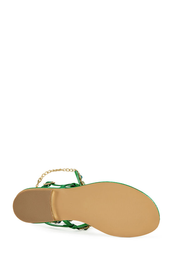 metallic green faux leather statement flat sandals with an adjustable ankle strap, multicolored rhinestone embellished straps, and gold chain accents on the ankle.