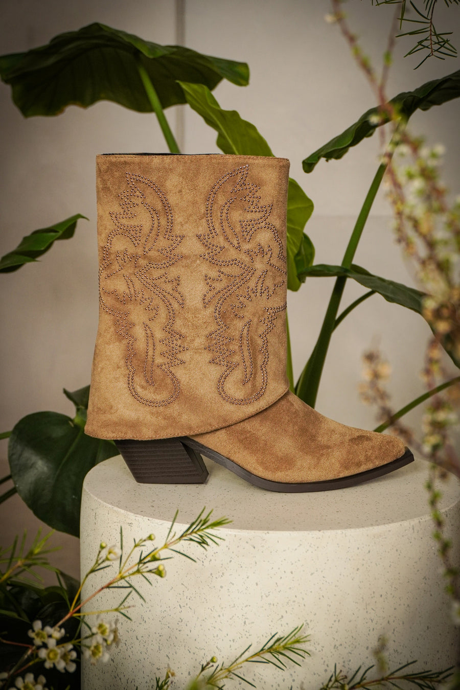 detail shot of Western suede fold over cowboy boots