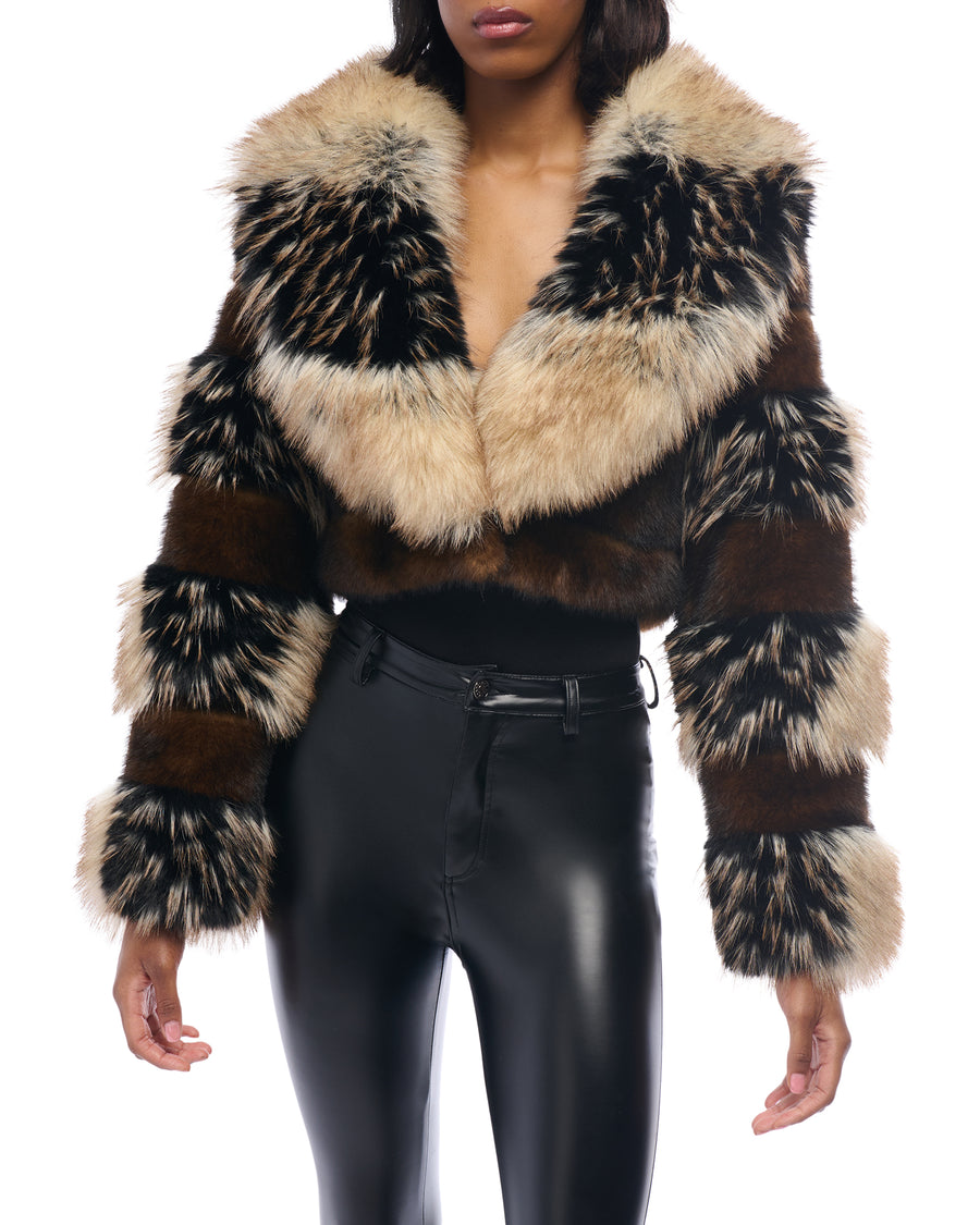 Brown cropped faux fur statement jacket featuring an oversized collar and patches of different shades of brown faux fur