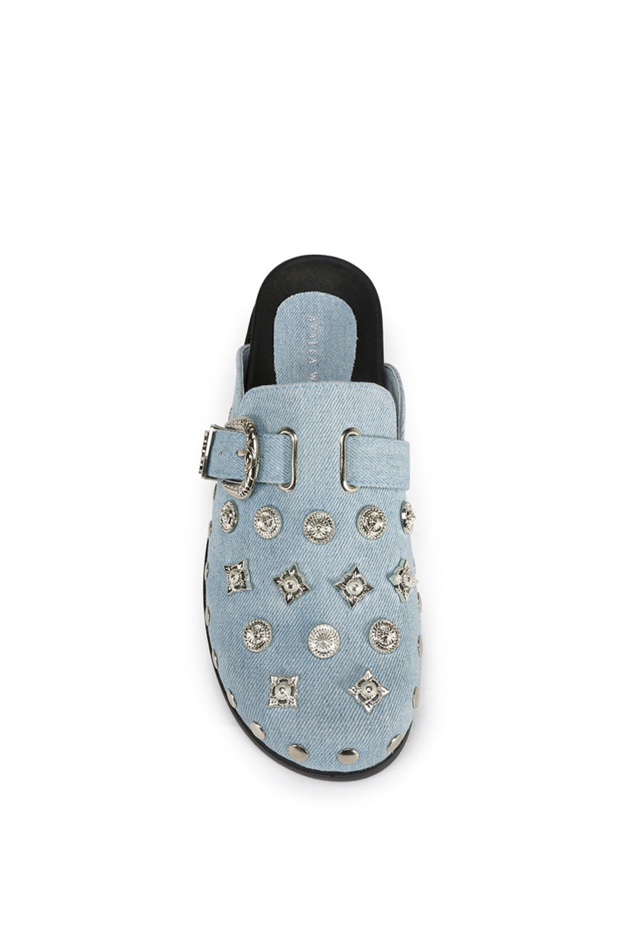 top view of light wash denim slip on western mule with silver studded accents and a western belt buckle detail