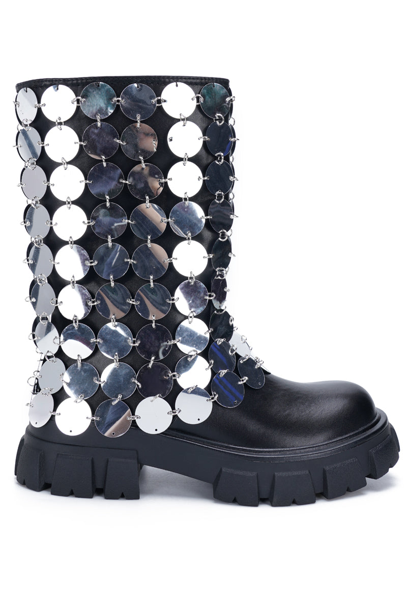 side view of black platform boots with a metallic circular chainmail accent overlay
