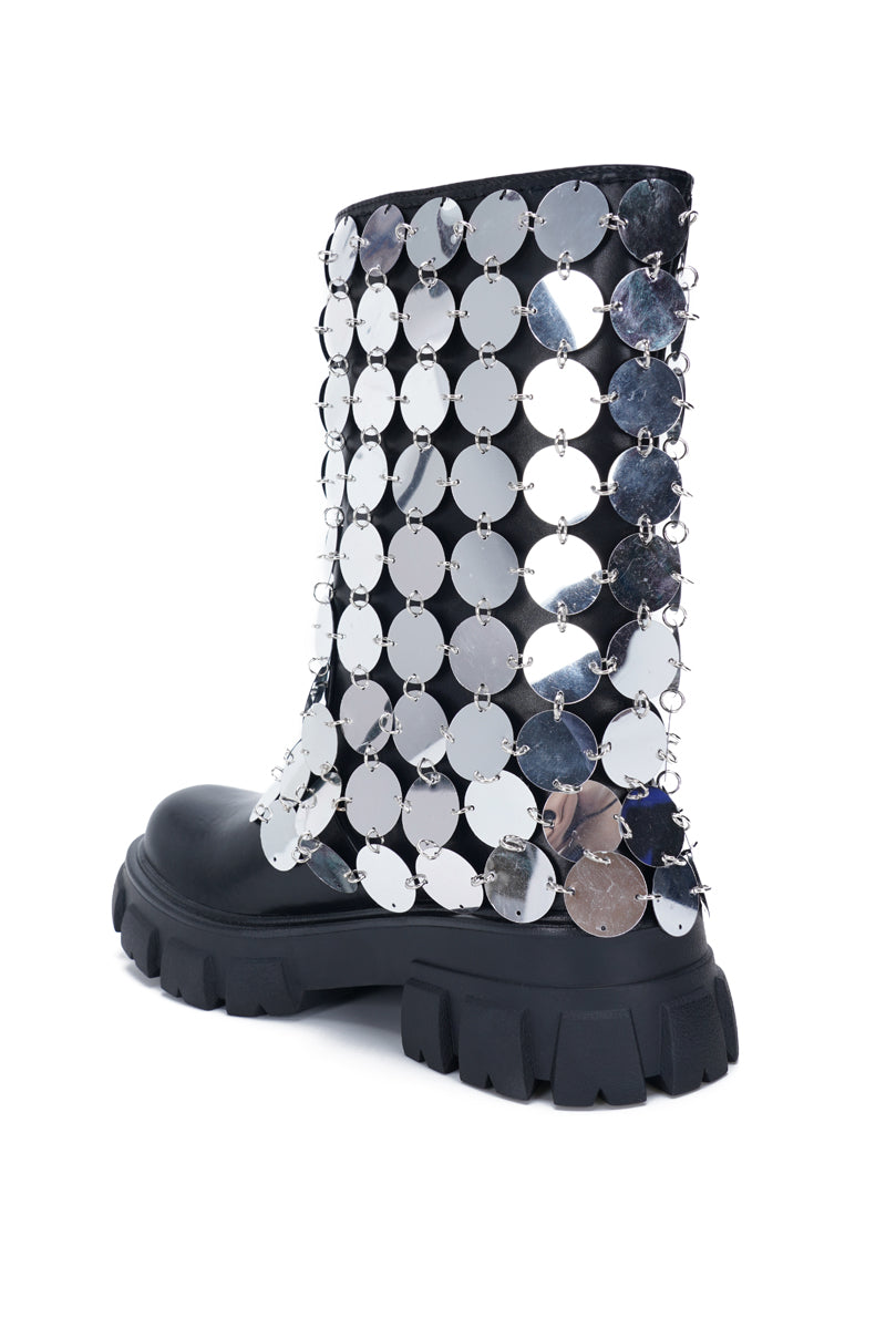 back view of black platform boots with a metallic circular chainmail accent overlay