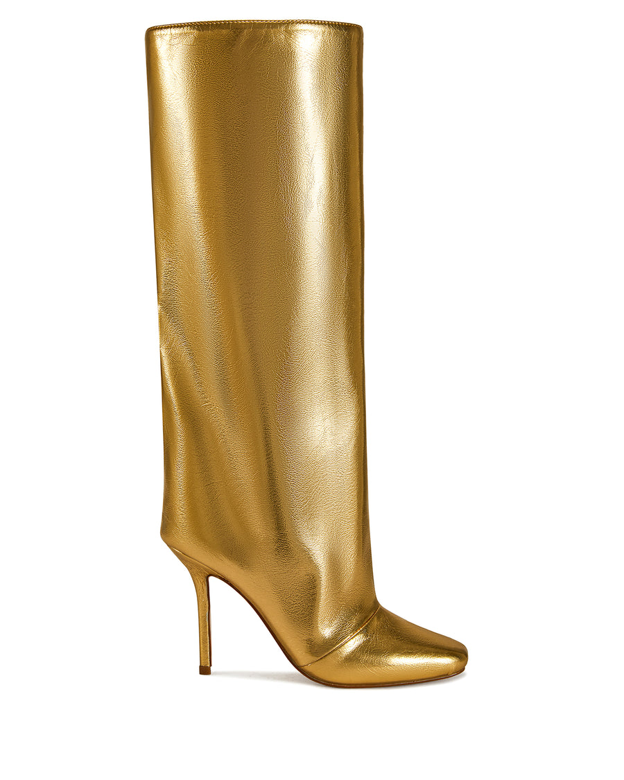 gold faux leather fashion forward knee high boots with a stiletto heel and a widened shaft with a subtle drape