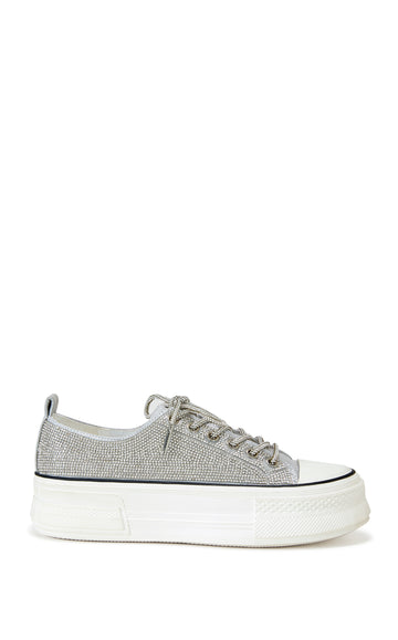 silver lace up sneaker with a white sole and sparkly glitter embellishments on the upper