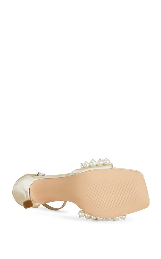 Cream satin open toe stiletto heels with an adjustable ankle strap and a faux pearl embellished foot strap