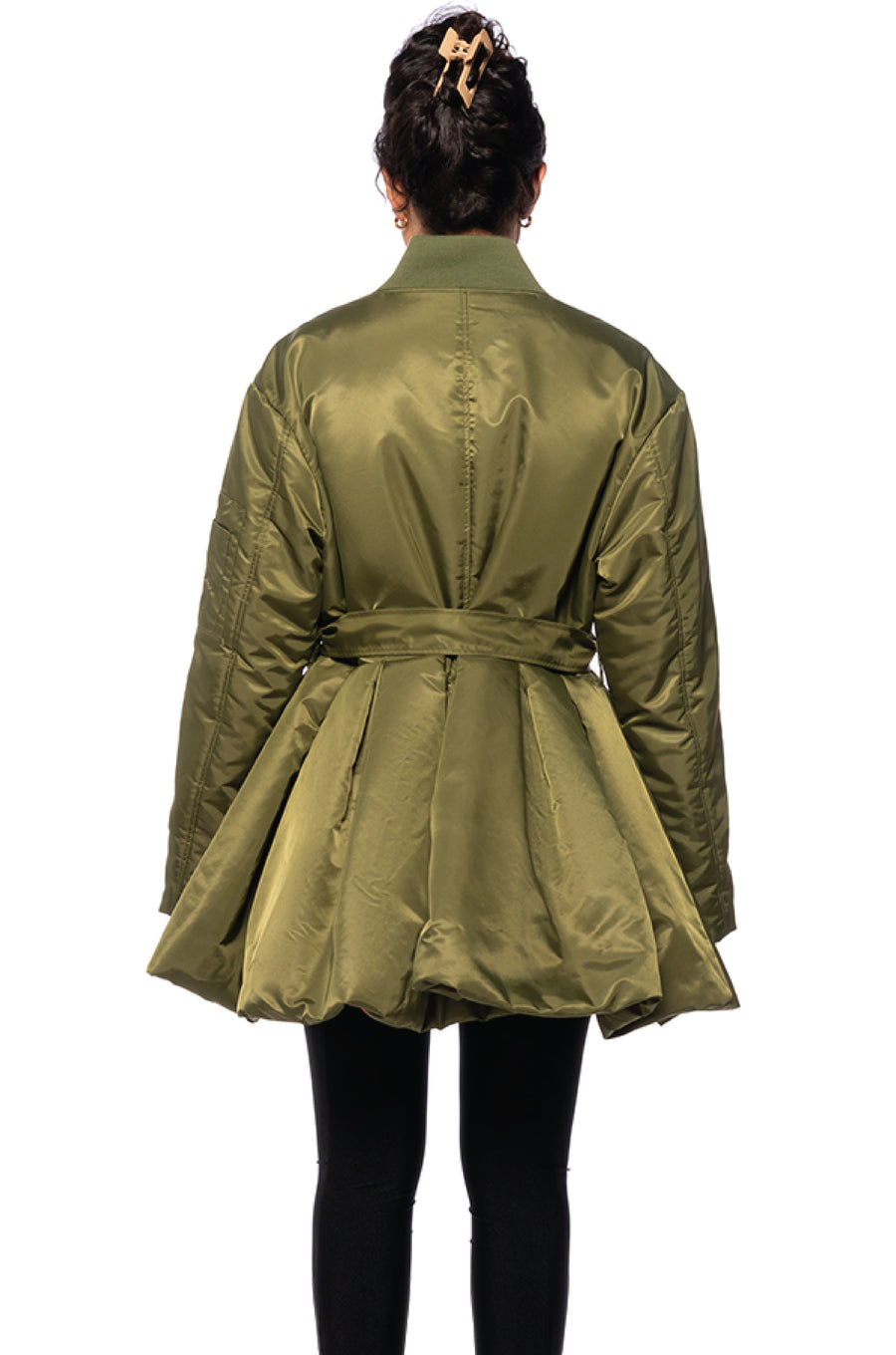 back view of olive green statement puffer jacket with a flared bottom and belt closure accent with an orange interior
