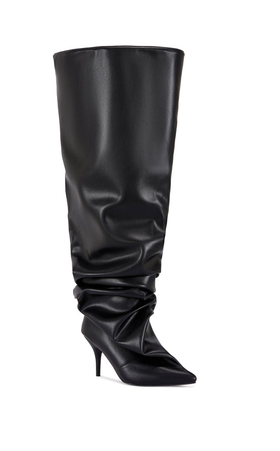 black faux leather statement knee high boot with a scrunched shaft, a stiletto heel, and an oversized shaft opening