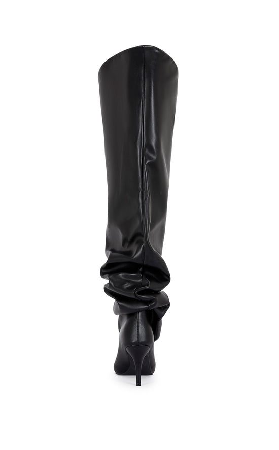 black faux leather statement knee high boot with a scrunched shaft, a stiletto heel, and an oversized shaft opening