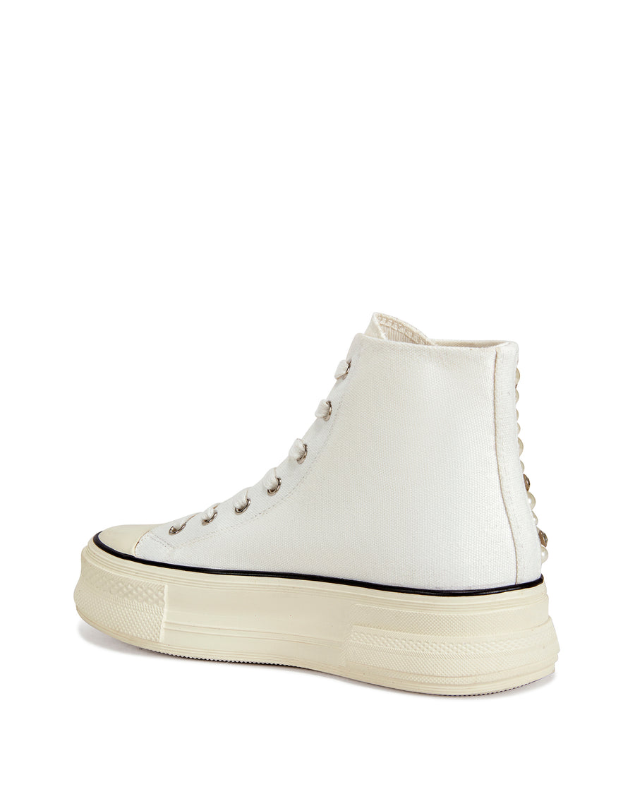 White lace up platform sneakers with faux pearl and rhinestone embellishments on the side