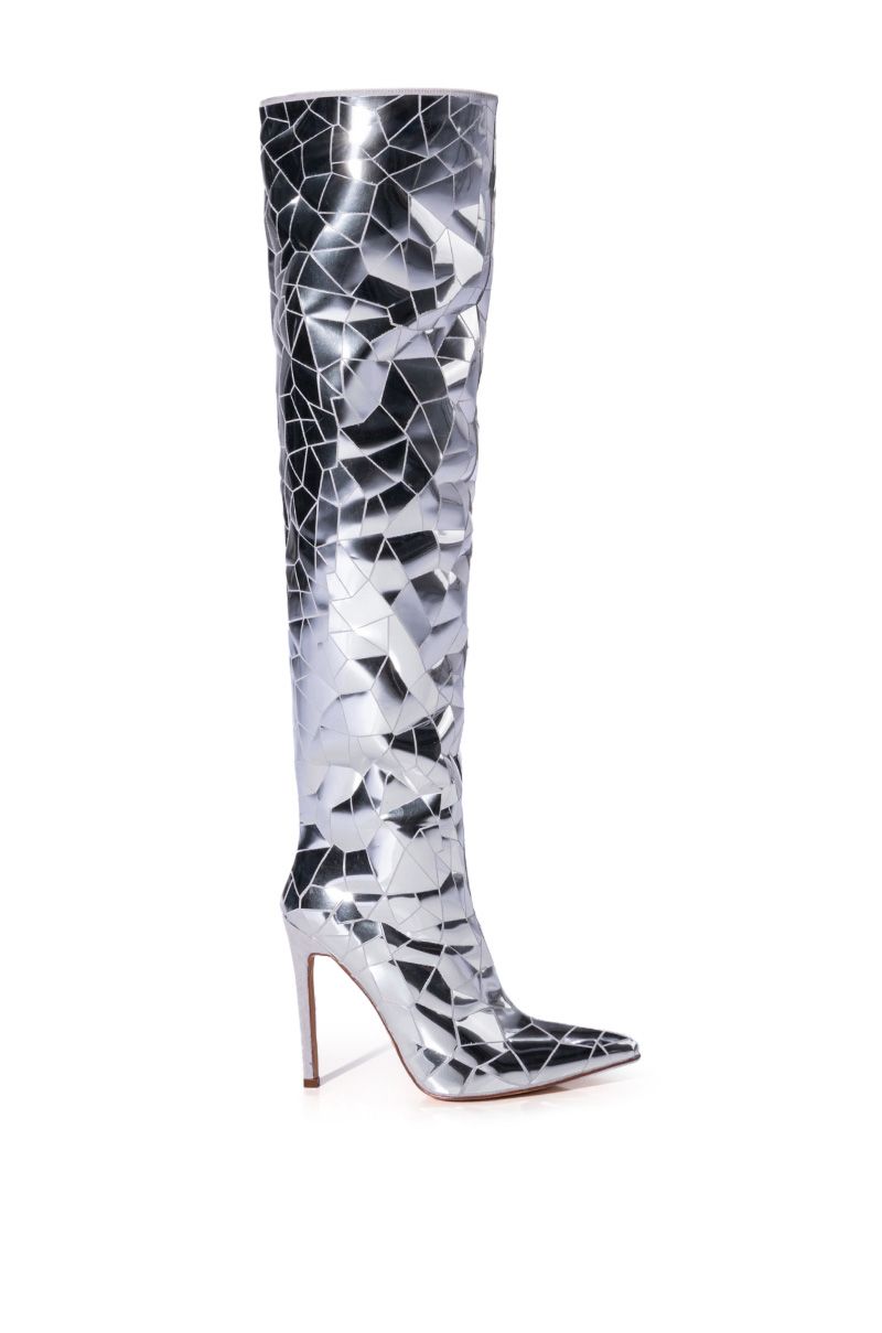 side view of shiny silver over the knee stiletto boot with a pointed toe and shattered glass pattern