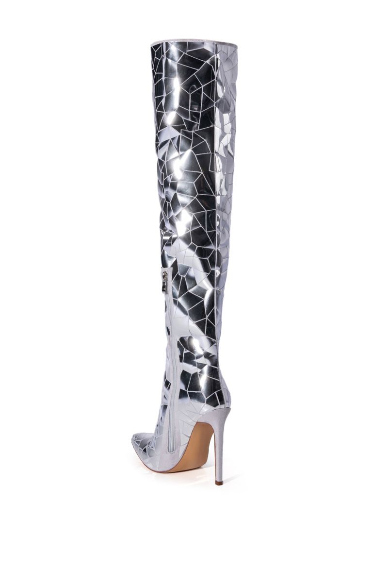 back view of shiny silver over the knee stiletto boot with a pointed toe and shattered glass pattern