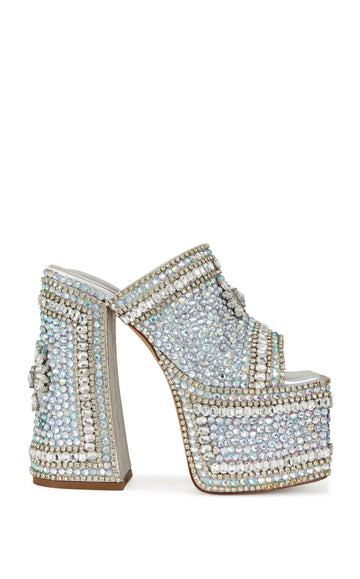 silver faux leather ultra platform statement heels with a block heel, open toe slip on design, and an all over rhinestone embellished design 
