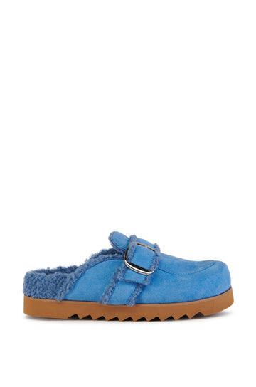 cozy blue faux suede statement mules with a ridged sole and faux sherpa lining inside the shoe. Finished with a silver buckle belted accent