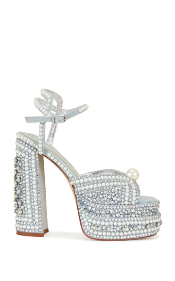 pale blue platform statement heels with a block heel, peep toe silhouette, adjustable ankle strap, and all over rhinestone and pearl embellishments