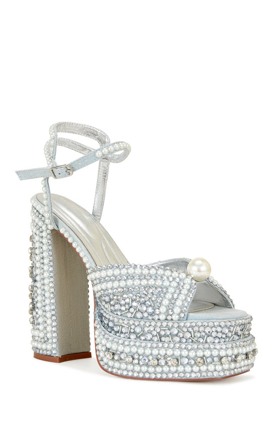pale blue platform statement heels with a block heel, peep toe silhouette, adjustable ankle strap, and all over rhinestone and pearl embellishments