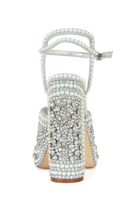 pale blue platform statement heels with a block heel, peep toe silhouette, adjustable ankle strap, and all over rhinestone and pearl embellishments