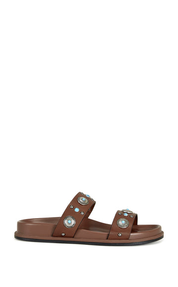 brown faux leather open toe flat sandals with two foot straps embellished with turquoise and silver studded accents