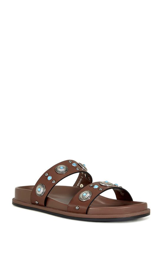 brown faux leather open toe flat sandals with two foot straps embellished with turquoise and silver studded accents