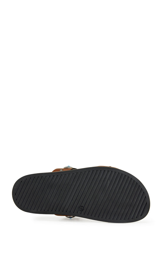 brown faux leather open toe flat sandals with two foot straps embellished with turquoise and silver studded accents