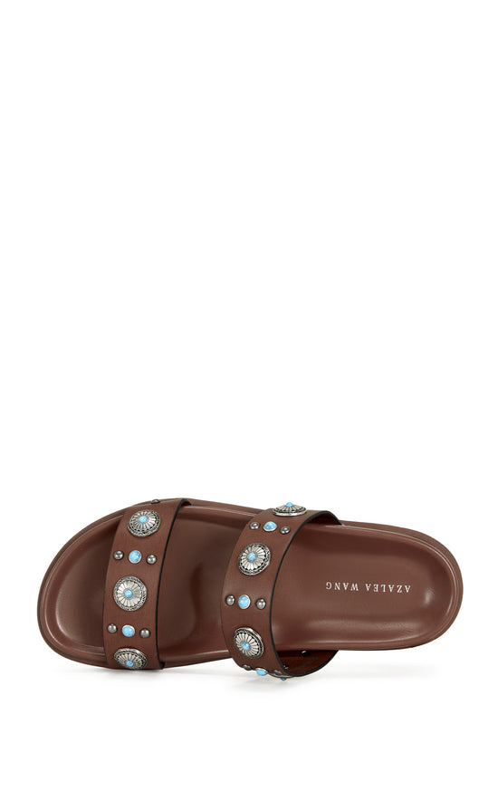 brown faux leather open toe flat sandals with two foot straps embellished with turquoise and silver studded accents
