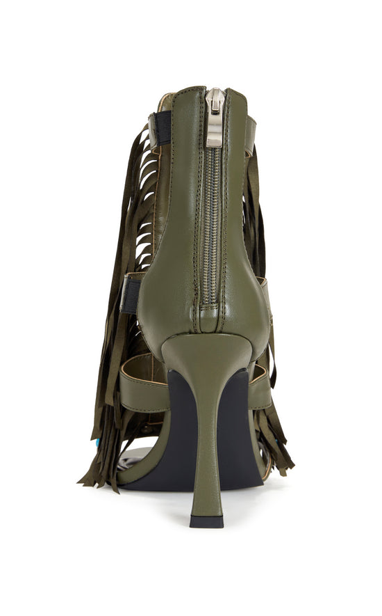 green faux leather strappy open toe sandals with a stiletto heel, and a green upper featuring faux suede fringe and turquoise studded embellishments, and a zip up closure on the ankle