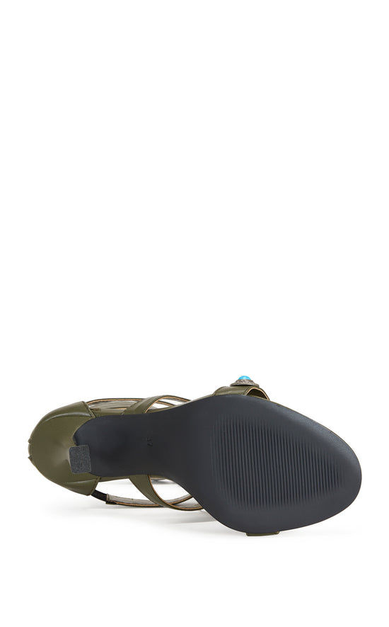 green faux leather strappy open toe sandals with a stiletto heel, and a green upper featuring faux suede fringe and turquoise studded embellishments, and a zip up closure on the ankle