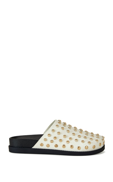 cream faux leather slip on mule with  gold stud embellishments and a black sole