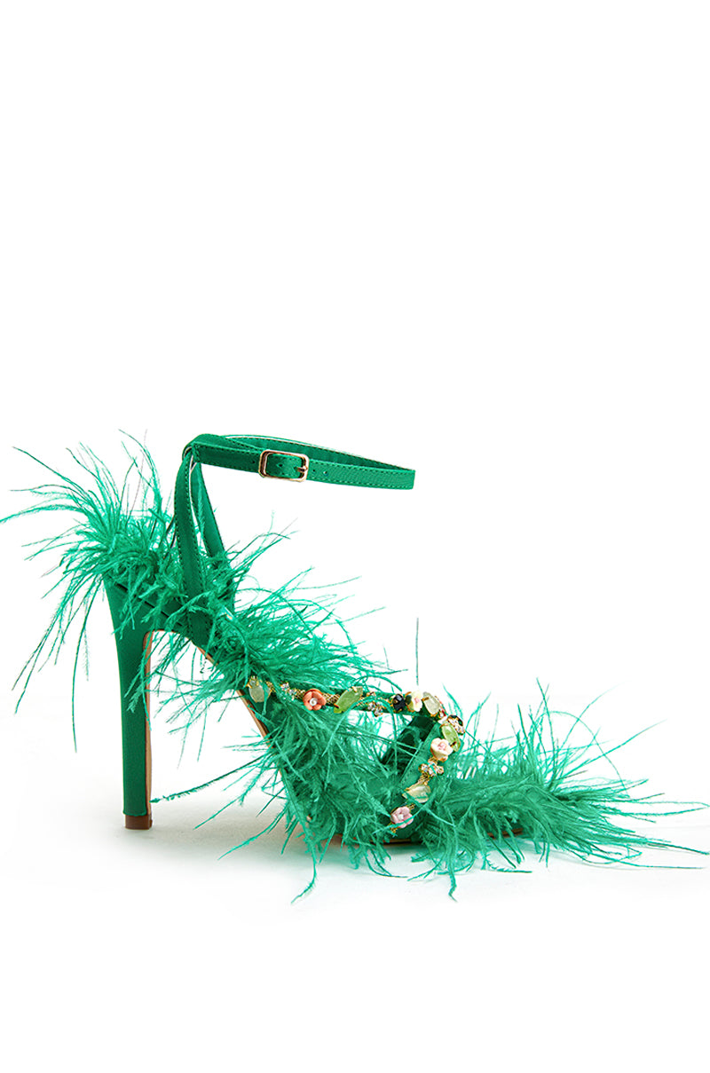 kelly green strappy heeled sandals with rhinestone gems on the straps and feather details around the shoe