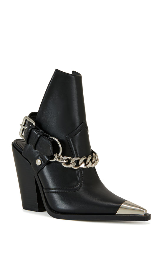 black faux leather statement western boots with a metal toe, black block heel, and and ankle cutout secured with a belted ankle strap closure