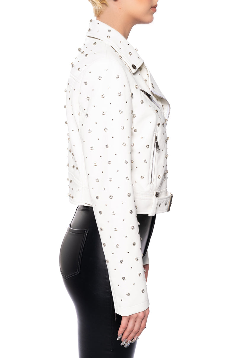 side view of white faux leather statement biker jacket with rhinestone accent details along the front, back, and sleeves