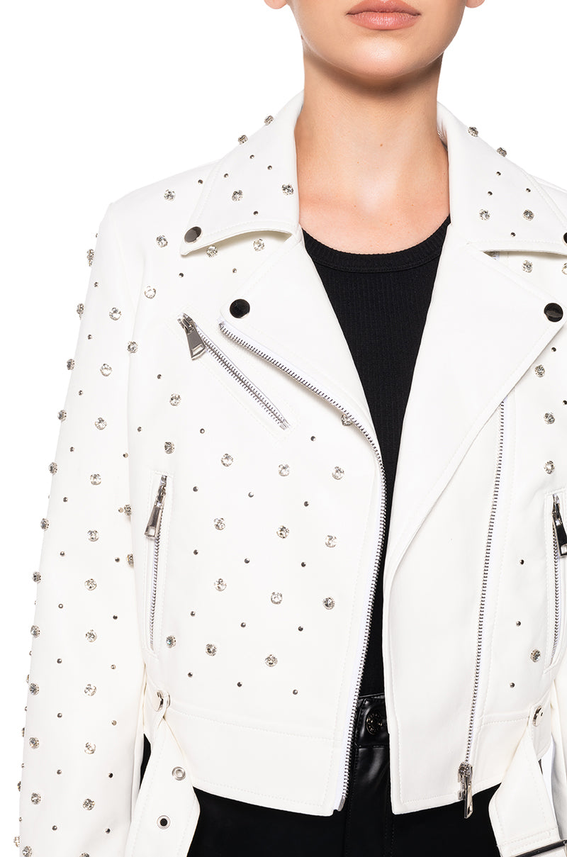detail shot of white faux leather statement biker jacket with rhinestone accent details along the front, back, and sleeves