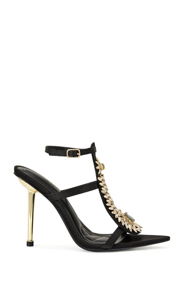 black faux leather statement open toe heels with rhinestone embellished designs on the upper, a metallic gold stiletto heel, and an adjustable ankle strap closure