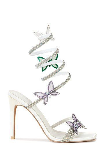 white faux leather open toe statement stiletto heel with a coil wrap embellished with rhinestones and butterfly accents
