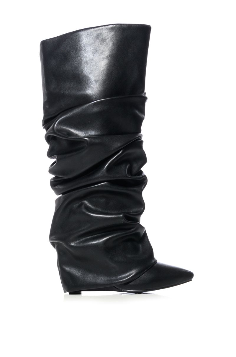 side view of black faux leather wedge boots with a pointed toe and ruched fold over silhouette