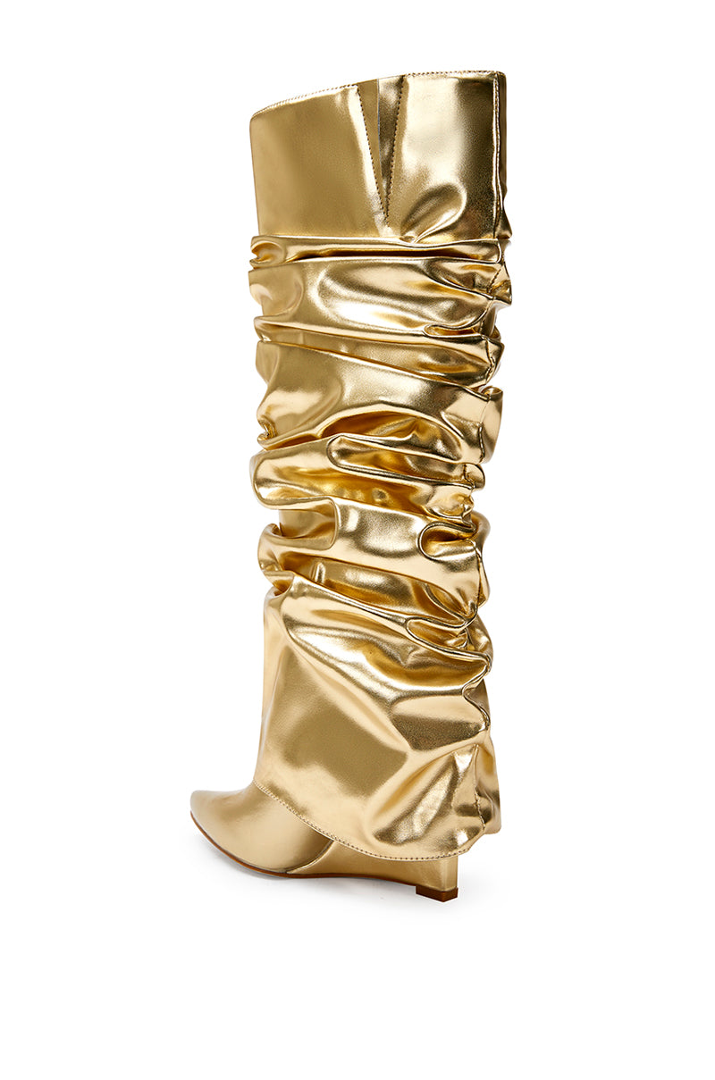 back view of metallic gold faux leather wedge boots with a pointed toe and ruched fold over silhouette