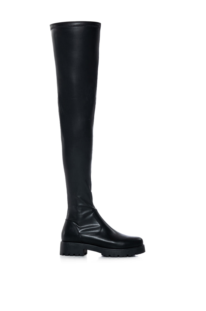 black faux leather over the knee stretchy flat boot made with 4 way stretch material