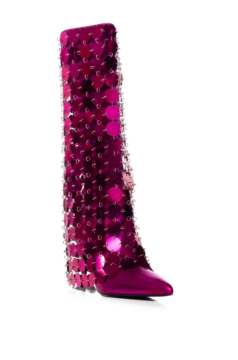 angled view of metallic pink pointed toe stiletto heels with discoball style circular shiny fuchsia fold over silhouette overlay