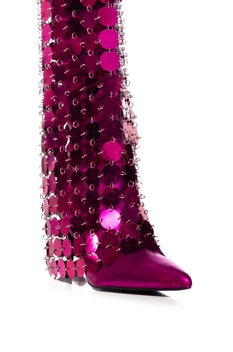 DETAIL VIEw of metallic pink pointed toe stiletto heels with discoball style circular shiny fuchsia fold over silhouette overlay